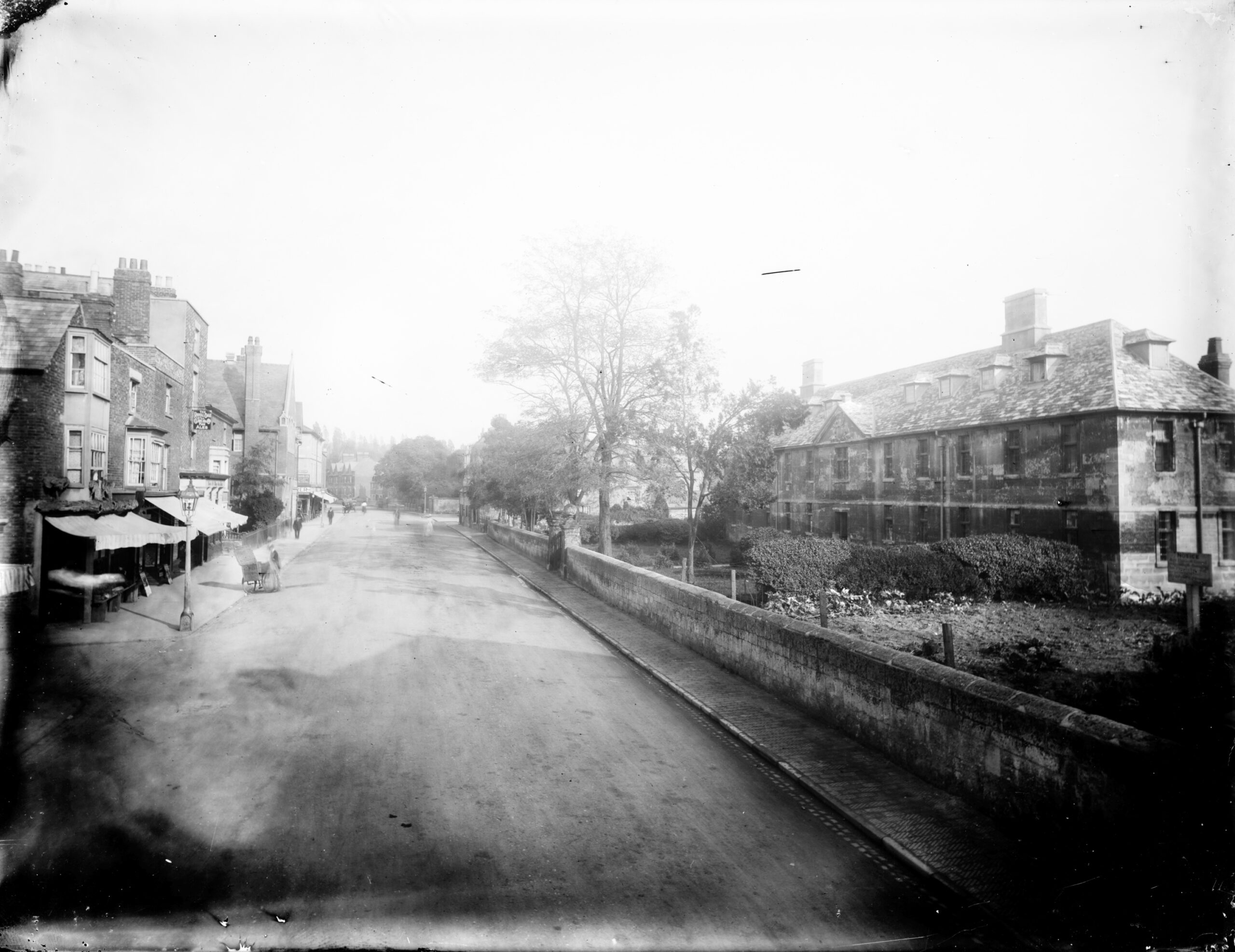 City-Of-Oxford-Charity-Historic-Photo-1 exterior view looking along the street with stones almshouses in the foreground. oxfordshire oxford oxford