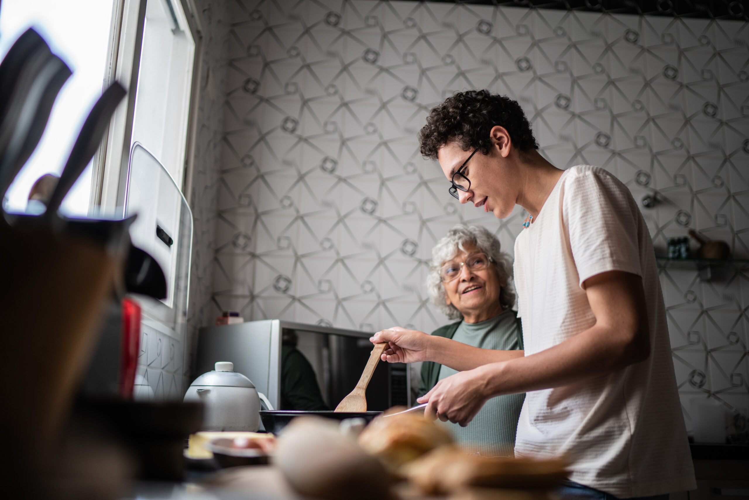 Grandson and grandmother cooking at home Grandson and grandmother cooking at home